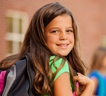 young girl wearing a backpack