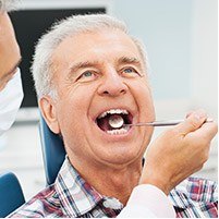 Senior man receiving dental checkup