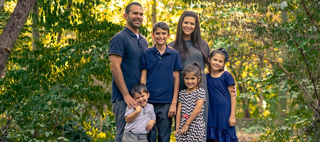 Owings Mills dentist Doctor Milner and his family outside