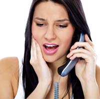 Woman calling her Owings Mills emergency dentist