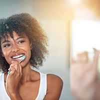 Woman brushing her teeth