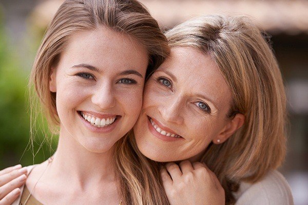 smiling mother and daughter
