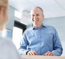 man setting up dental appointment