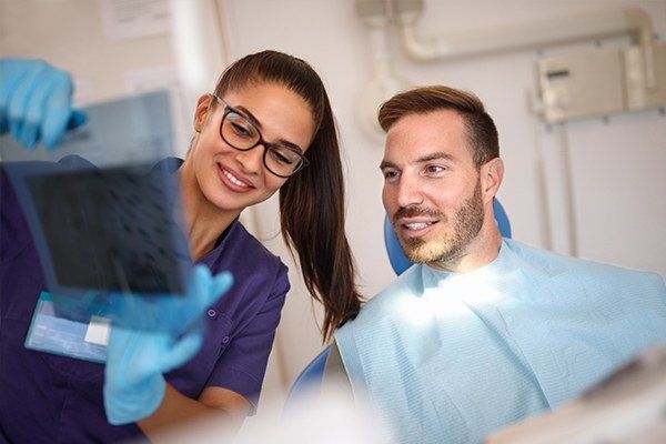 man scheduling dental appointment