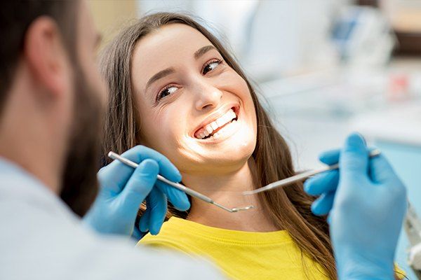 woman smiling in dental chair