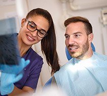 Man talking with dental team