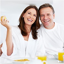 Owings Mills Dental Services Smiling man and woman in bathrobes