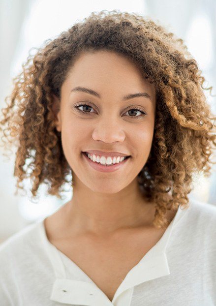 Young woman with gorgeous smile wearing white shirt