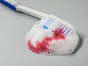 a toothbrush with blood on it