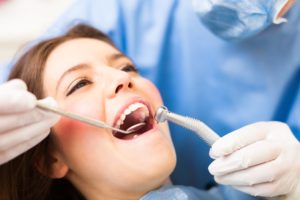 Woman receiving oral exam.