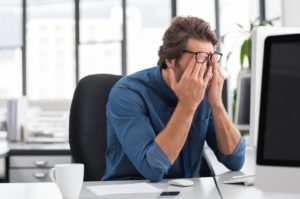 Tired man at desk