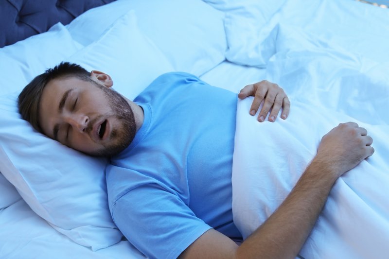 Young man snoring while sleeping