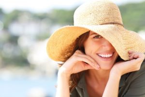 Woman with perfect teeth enjoying long-lasting results of cosmetic dentistry