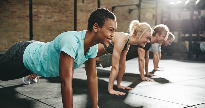 Women smiling while exercising.
