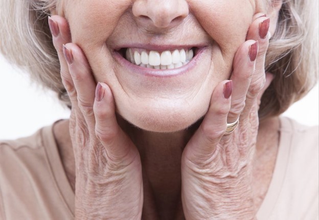 person smiling after having soft, spongy gums treated
