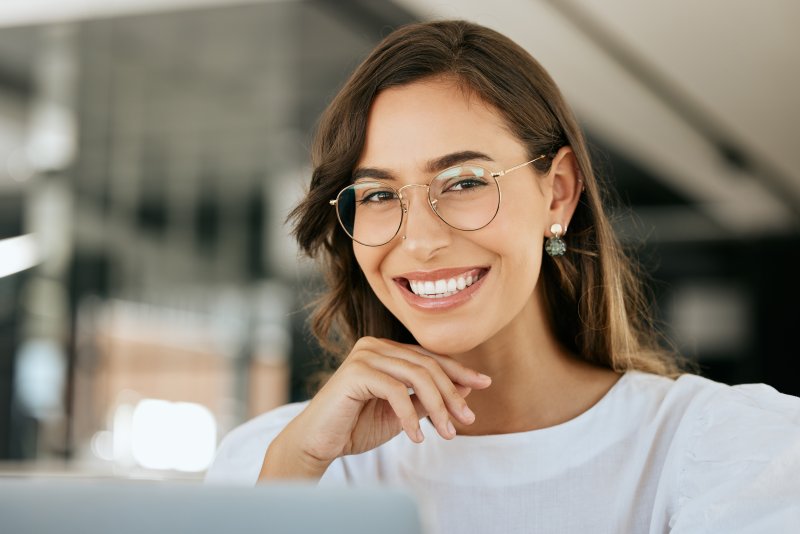 A smiling woman working in an office