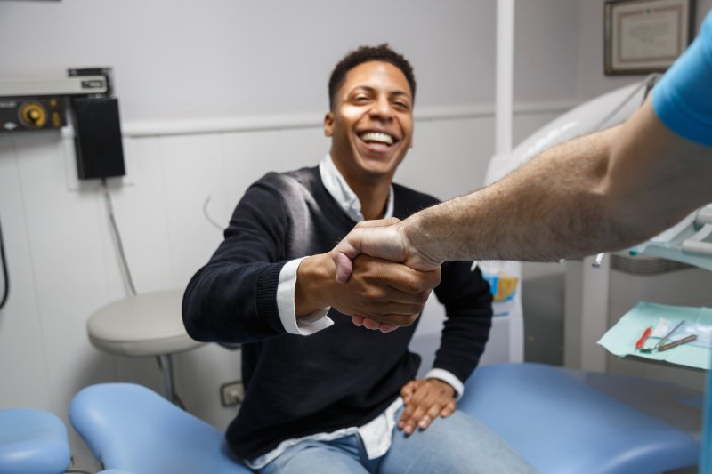 Patient smiling after dental implant consultations
